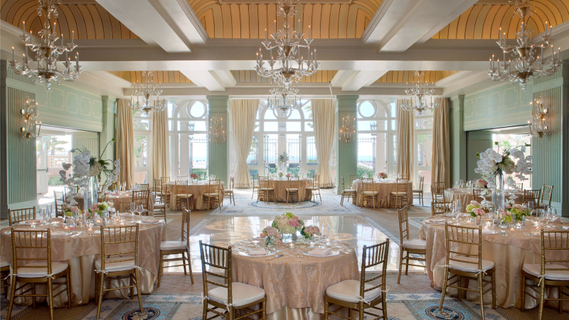 wedding tables set for the reception in the ballroom